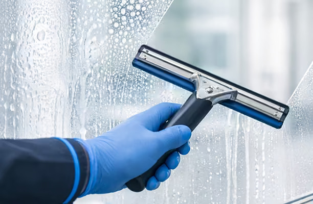 Interior window and glass partition cleaning in a commercial building